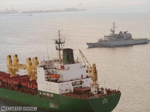 A French frigate shadows a commercial ship leaving Djibouti harbor on its way to the Gulf of Aden.