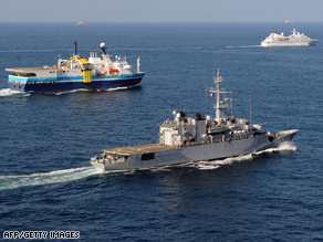 The French frigate Nivose escorts commercial ships in the Gulf of Aden on November 28.