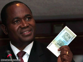 Zimbabwe central bank governor Gideon Gono shows a new $50 million note at a news conference Thursday.