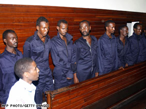 Some of the suspects facing trial are shown last month being arraigned in a Mombasa, Kenya, courtroom.