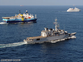 A French frigate, center, escorts ships off the coast of Djibouti to protect them from piracy last month.