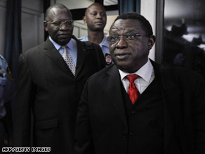 Theoneste Bagosora, right, and his co-defendant Anatole Nsengiyumva, left, arrive in court.