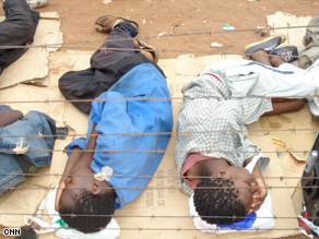 Children sleep in rough conditions on the border between Zimbabwe and South Africa.