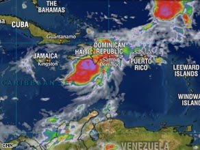 People in Port-au-Prince, Haiti, walk through the rain Monday after Gustav formed quickly in the Caribbean.