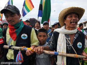 Protesters march this week along the Pan-American Highway in Villarrica, Colombia.