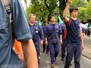 Thousands of autoworkers march Monday in Buenos Aires, Argentina, opposing recent cuts in the industry.