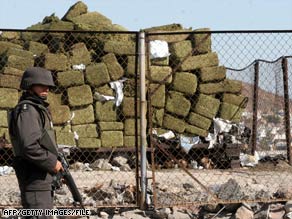 Mexico is the top marijuana producer, a U.N. report says. Here, a member of Mexico's army guards a drug seizure.