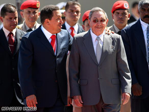 Venezuelan President Hugo Chavez, left, greets Cuban President Raul Castro in Caracas on Saturday.