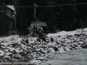 One gondola car is suspended above an icy creek at a ski resort near Whistler, British Columbia.