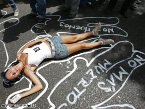 A chalk message reads No More Murders as a student protests  killings in Caracas in this file photo.