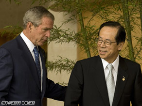 President Bush speaks with Prime Minister Yasuo Fukuda at a Sunday news conference in Toyako, Japan.