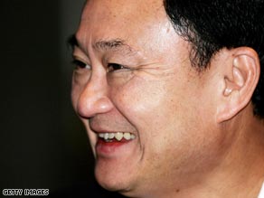 Thailand's former prime minister Thaksin Shinnawatra answers questions from media in Bangkok.