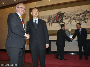 Delegates, includijng U.S. Assistant Secretary of State Christopher Hill, left, at a meeting on July 12 in Beijing.