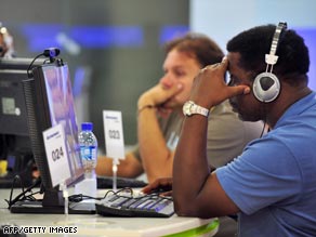 Journalists surf the Internet at the main Olympics press center in Beijing.