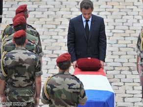 President Sarkozy pays tribute to the fallen troops at a  ceremony in Paris.