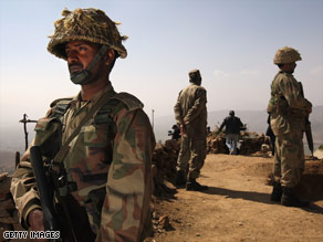 Pakistani Army soldiers stand guard in northwestern Pakistan on the alert for insurgents on February 25.