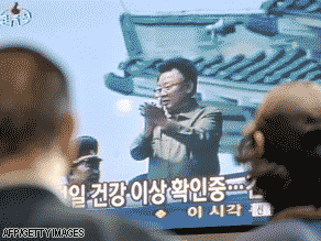 South Koreans watch a TV screen reporting on Kim Jong Il at a rail station in Seoul on Wednesday.