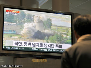 A South Korean looks at the demolition of a cooling tower at the North's Yongbyon nuclear complex, June 27, 2008.