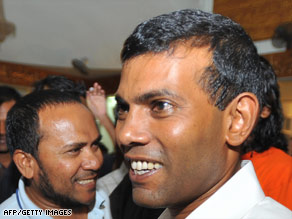 Mohamed Nasheed, right, shakes hands with supporters after he emerged winner of the presidential election.