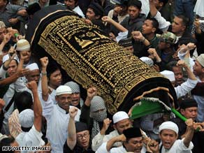 Relatives and supporters of Imam Samudra carry his body during a funeral Sunday in Serang, Indonesia.