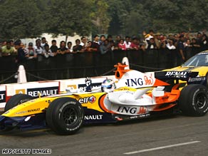 A Renault Formula 1 car performs during a roadshow in New Delhi, India, on November 9.