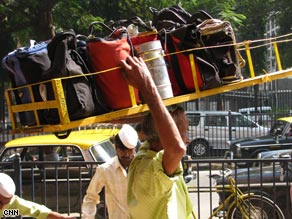 Manish Tripathi is responsible for bringing some parta of the dabbawala operation into at least the 20th century.