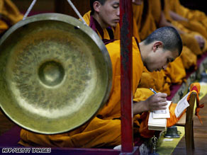 Tibetan monks in exile pray at a temple in Dharamsala, India, on Sunday.