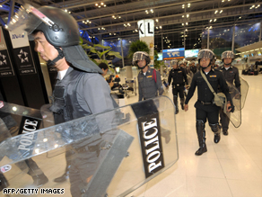 Anti-government protesters cheer at Suvarnabhumi airport, Bangkok.