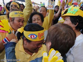 Anti-government protesters celebrate court decision against ruling party at Suvarnabhumi airport.