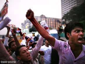 Angry demonstrators in Mumbai shout anti-Pakistan slogans on Wednesday.