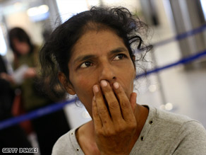 Samuel holds Moshe at the Mumbai airport in India on their way to Israel on December 1.