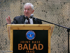 U.S. Defense Secretary Robert Gates speaks to U.S. troops at Joint Base Balad in Iraq on Saturday.