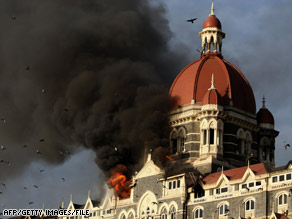 Flames and smoke gush from the Taj Mahal hotel in Mumbai, India, on November 27.