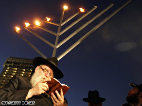 Rabbi Moshe Kotlarsky recites a prayer in observance of Hanukkah on Thursday in Mumbai, India.