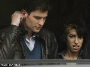Blake Fielder-Civil, pictured with wife Amy Winehouse, has admitted inflicting grievous bodily harm.