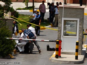 Police and emergency officials at the scene of the attack outside the U.S. consulate in Istanbul