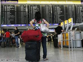 A passenger checks the departure board at Frankfurt airport.