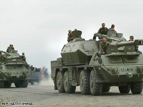 Georgian troops in armoured personnel carriers deploy to support the campaign to regain control of South Ossetia.