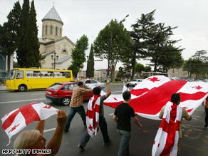 Georgians march in the capital, Tbilisi, on Tuesday to protest Russia's military invasion of their country.