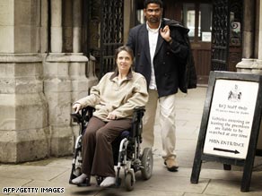 Debbie Purdy and her husband Omar Puente pictured outside London's High Court.