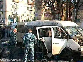 Police investigate the cause of the bomb blast in North Ossetia, which killed 12 people Thursday.