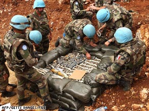 French troops examine cluster bombs collected after the Lebanon conflict of 2006.