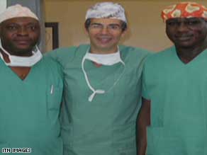 British surgeon David Nott with two colleagues in a Congo field hospital where Nott saved a boy's life.