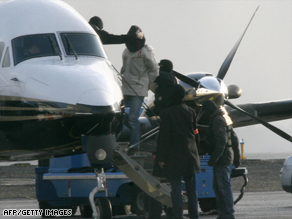 French policemen escort suspected ETA members to a plane earlier this month.
