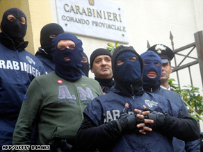 Members of the caribinieri outside their Palermo HQ Tuesday following raids against Sicilian mafia suspects.