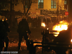 Riot police force protesters back in central Athens on December 20.