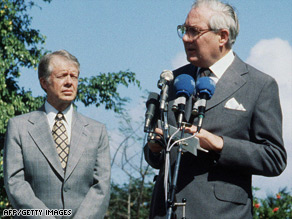 U.S. President Jimmy Carter watches UK PM James Callaghan speak at a 1979 meeting in Guadeloupe.