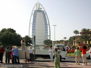 The Burj al-Arab (L) and Jumeirah Beach hotels in Dubai