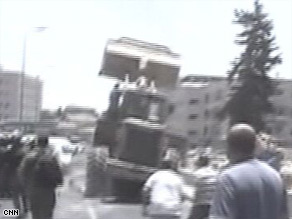 Police and onlookers rushed after the bulldozer as it continued its rampage in western Jerusalem.