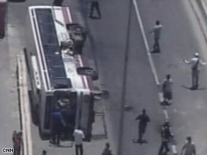 A bus lies on its side after the bulldozer rampage in the western part of Jerusalem Wednesday.
